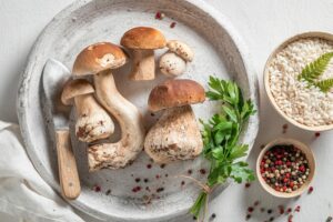 ingredients for homemade risotto made of wild mushrooms and herbs